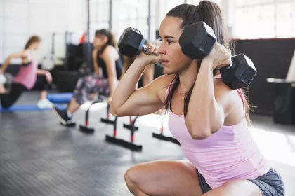 Woman exercising with a dumbbell